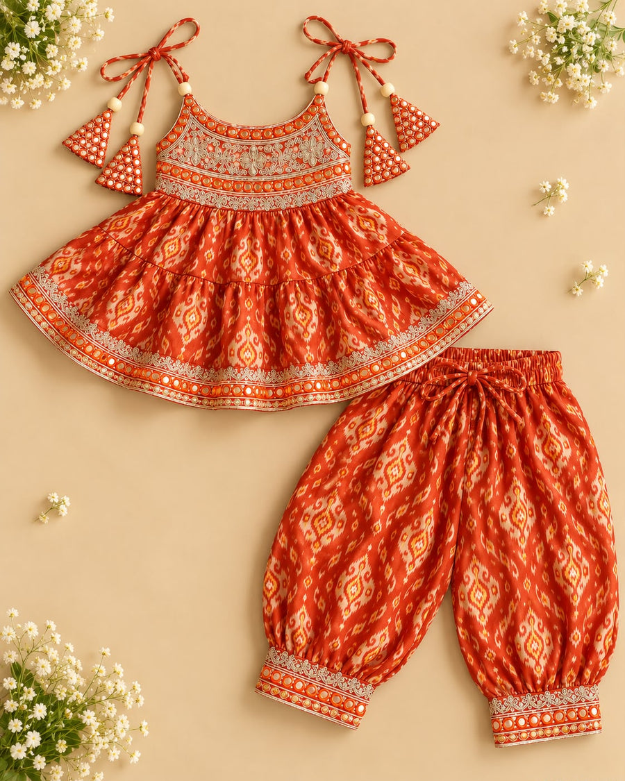 Rust Orange ikat muslin tie-up kurti with mirror-work embroidery and matching afghani pants for girls
