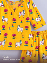 Pichwai Cord Set Yellow – close-up of the Pichwai cow print